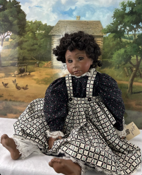 Image of Toebi Porcelain Doll from Terri's Tiny Treasures: A vintage-inspired doll with dark floral dress and soulful eyes, perfect for collectors and enthusiasts.